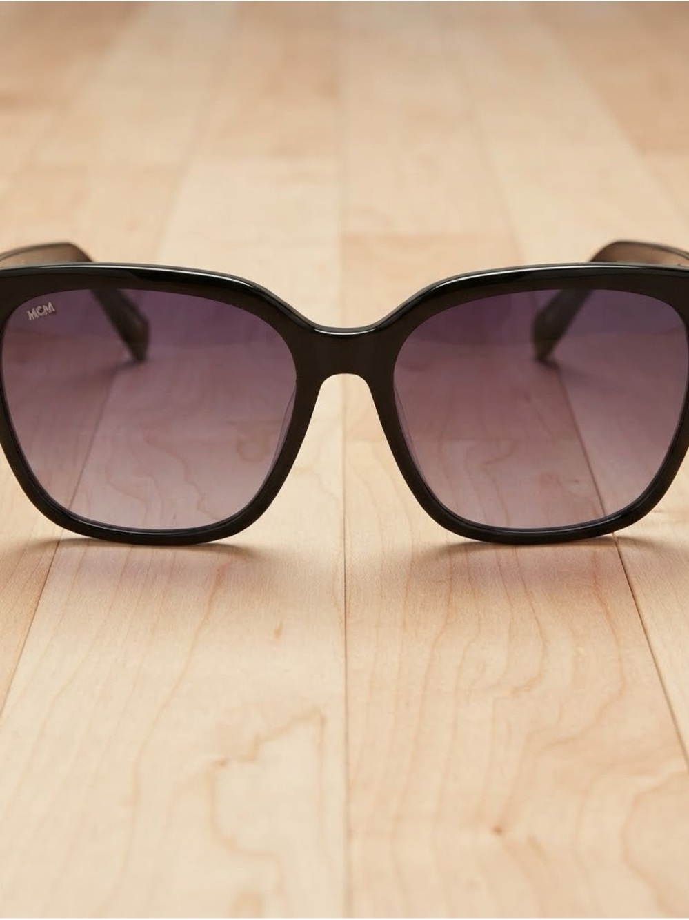 MCM Black Frame Sunglasses with Purple Gradient Lenses